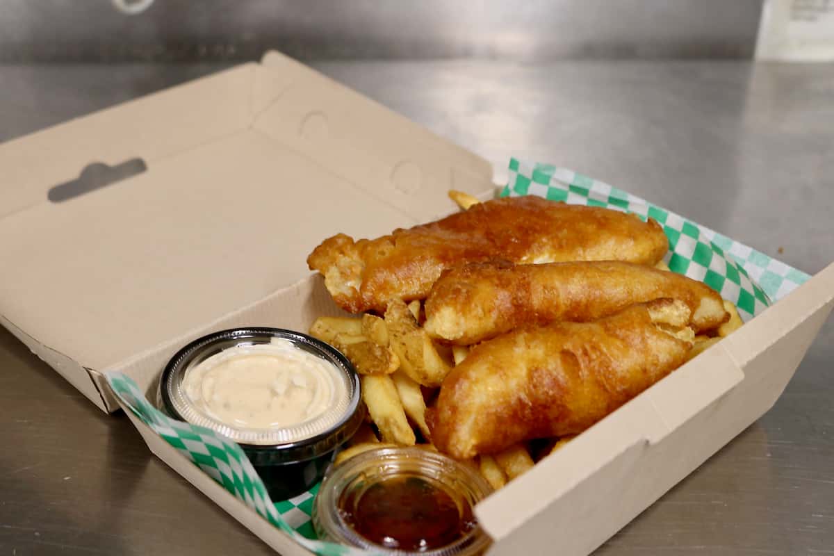Fresh local Haddock beer battered pub style fish fillets served with french fries, malt vinegar, and tartar sauce