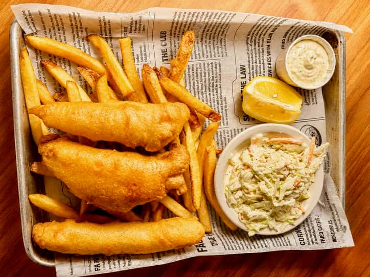 Fish and Chips Salem: 3 pieces of fried haddock with fries, cole slaw, sauce and lemon