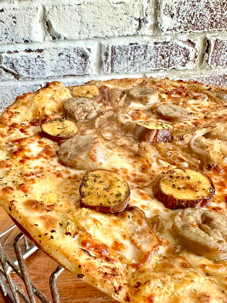 With Brew Homemade Beer Cheese Sauce, Krauss Meats Beer Brats, Pretzel Coins, Onion, Mozzarella and Provolone Cheese