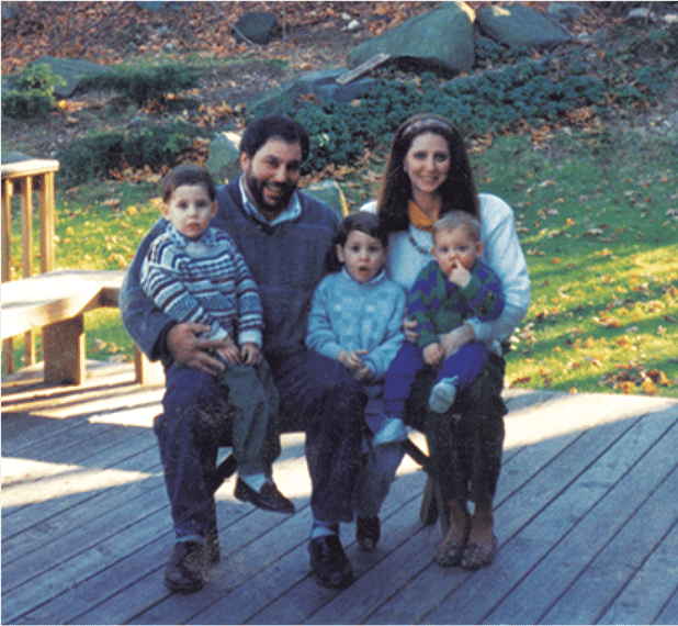 leah and her family outside posing for a photo