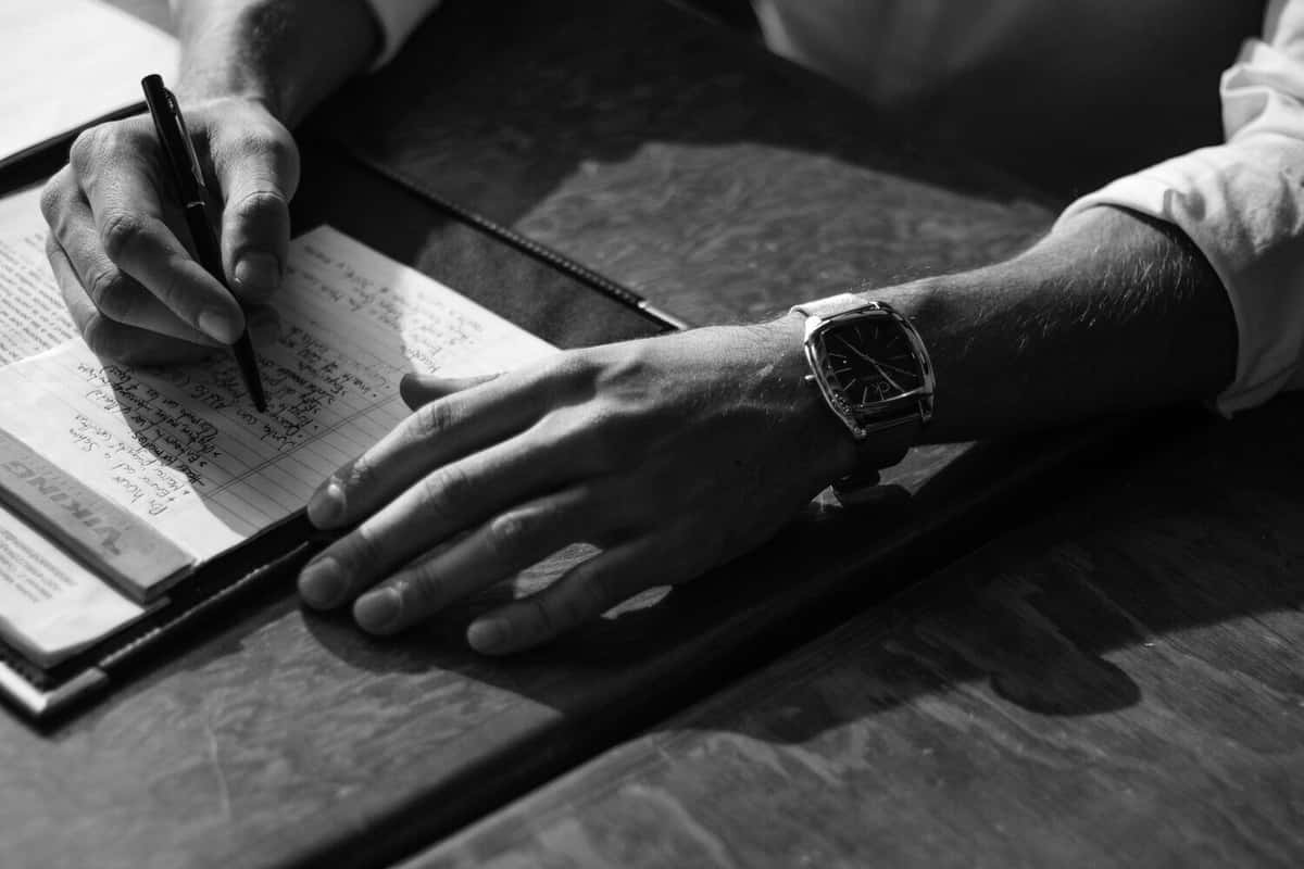 Man writing on a notepad
