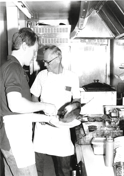 vintage photo of two men in the kitchen