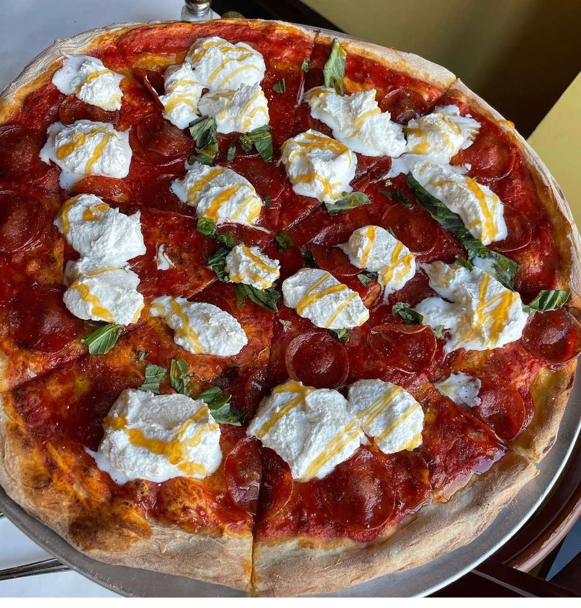 Pepperoni, Creamy Burrata, Hot Honey Drizzle, Fresh Basil, Tomato Sauce, Salt and Pepper, Sweet and Spicy Pizza, Gourmet Flavor, Artisan Pizzeria, Perfectly Balanced Toppings, Crispy Crust.