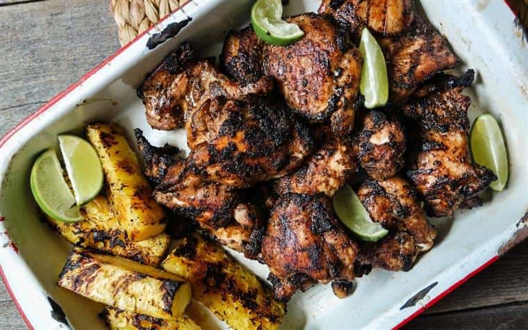 jerk chicken and plantains in a baking dish