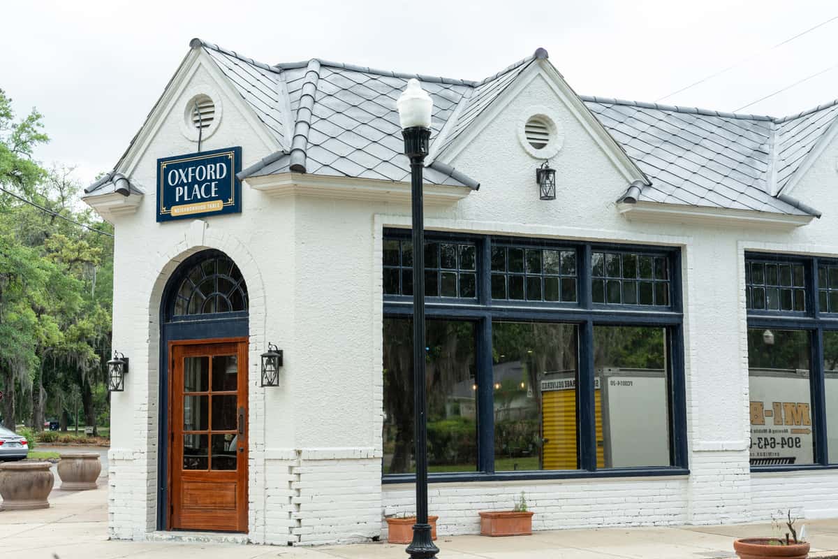 Oxford Place neighborhood restaurant exterior with white brick walls and welcoming entrance