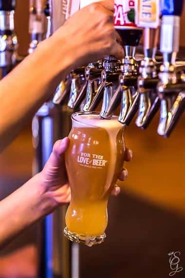 bartender dispensing beer in a glass
