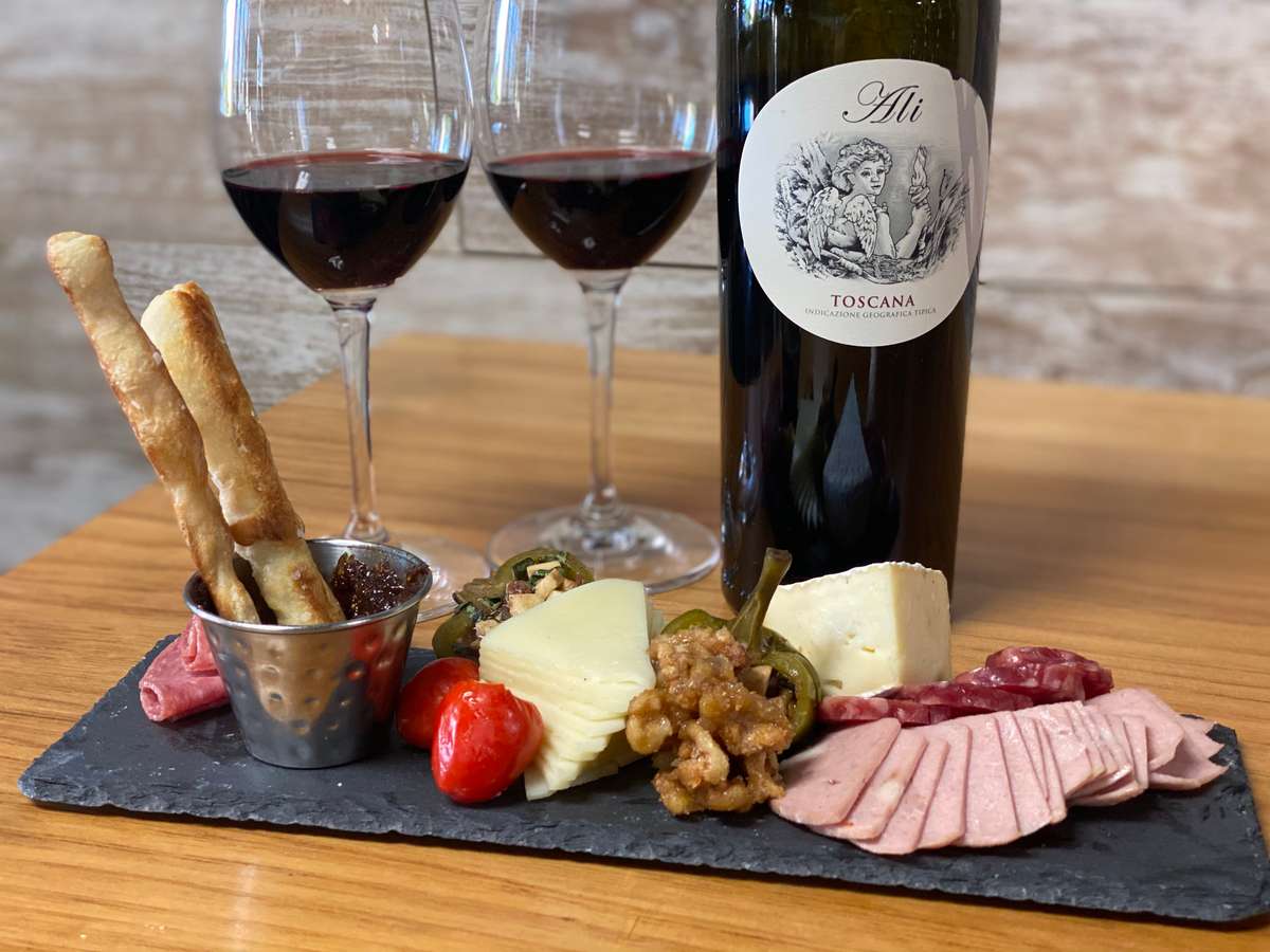 Charcuterie board with wine