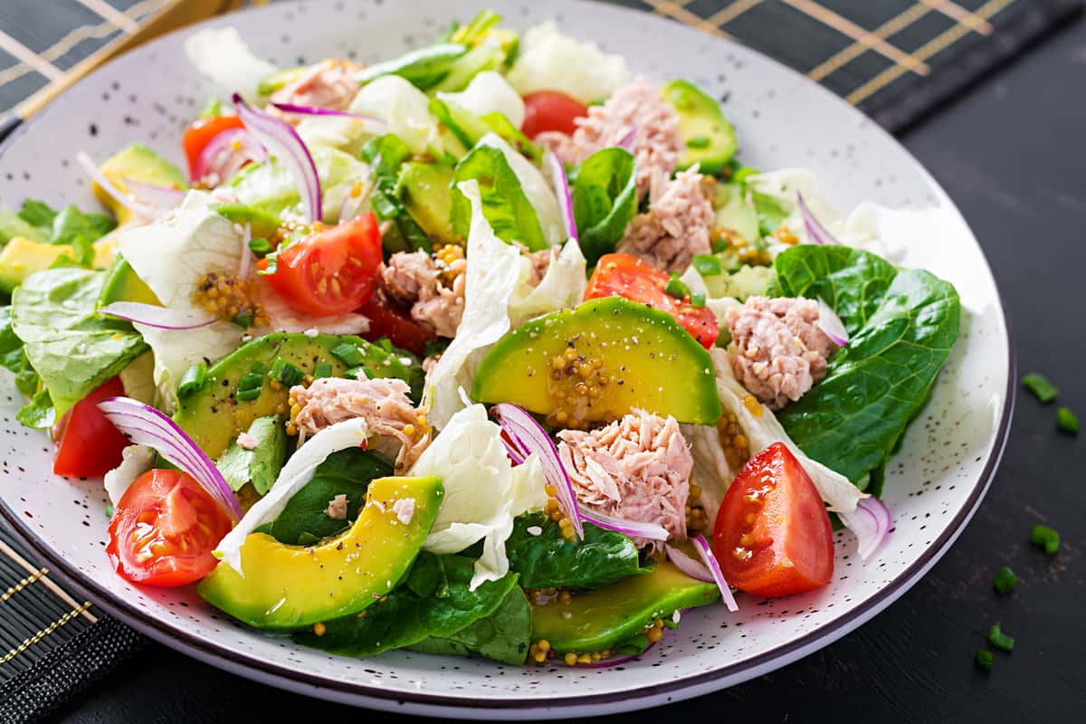 tuna fish salad with lettuce cherry tomatoes avocado red-onions