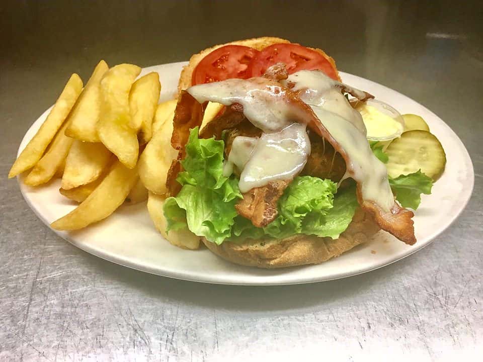 Bacon cheese burger with lettuce, tomato, pickles and French fries