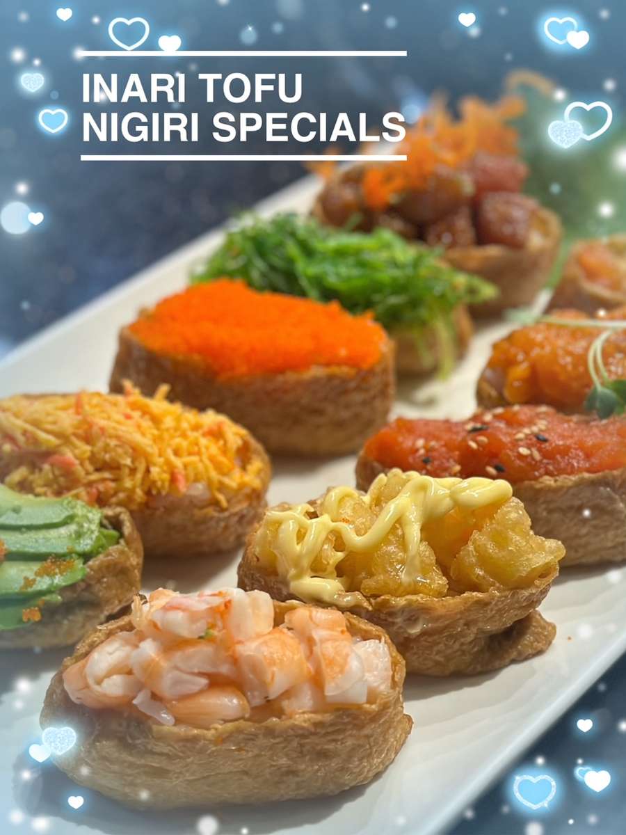 An assortment of sushi, including tuna nigiri on shiso leaf with salmon and unagi  nigiri in the background, is arranged on a ceramic plate with a yell Stock  Photo - Alamy, image size:900x1200