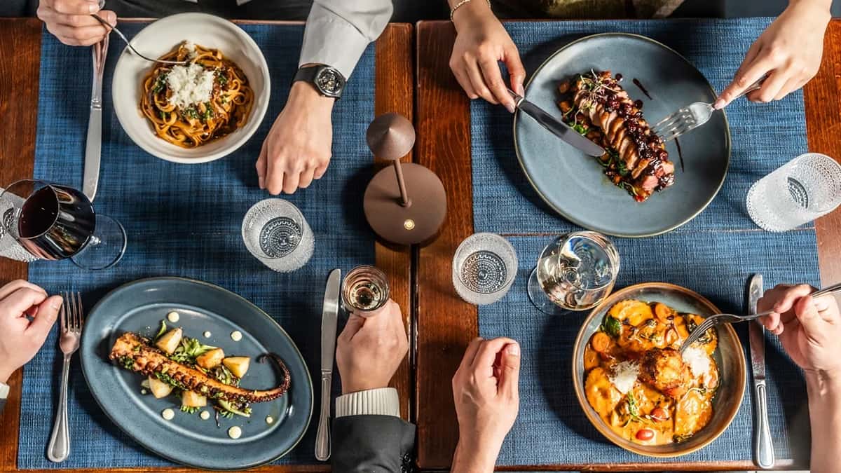 dinner table with menu dishes