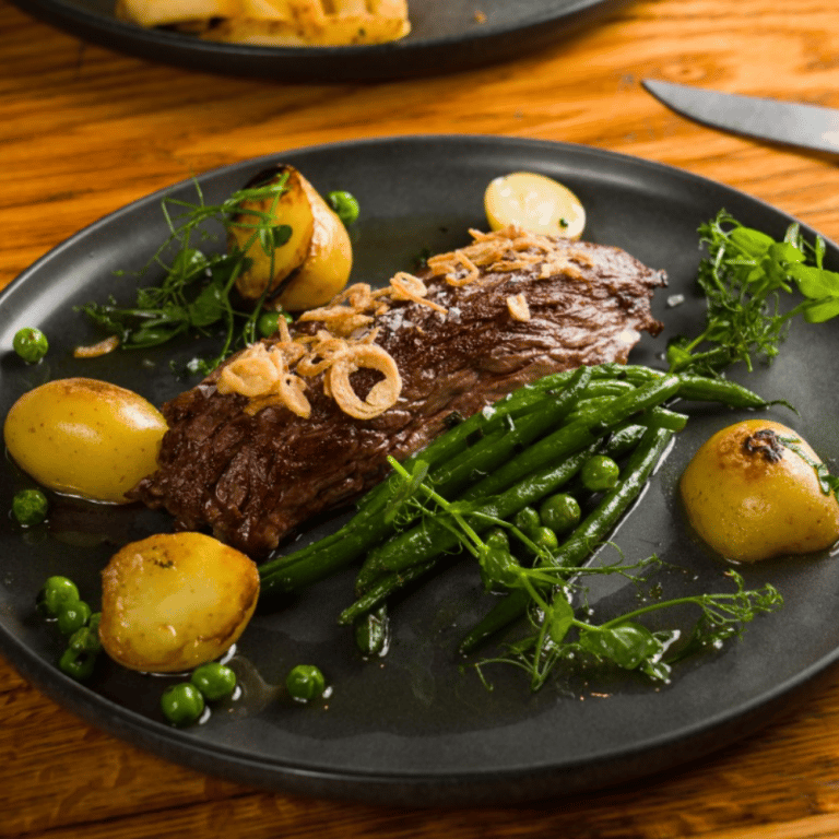 Hanger steak 8 oz, roasted potatoes, green peppercorn sauce