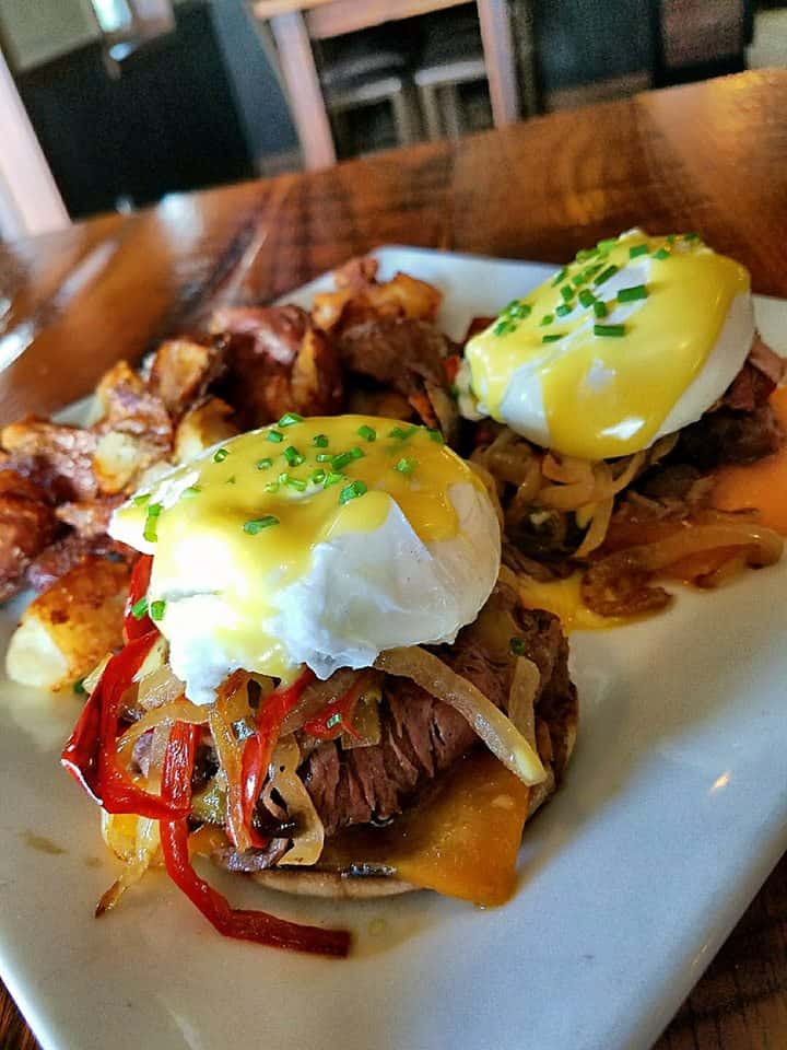 pulled pork sandwiches with eggs benedict on top