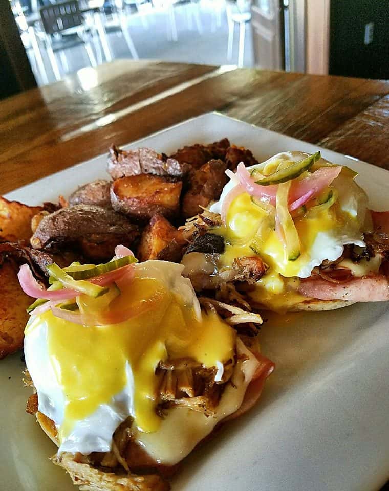 eggs benedict with ham and a side of home fries