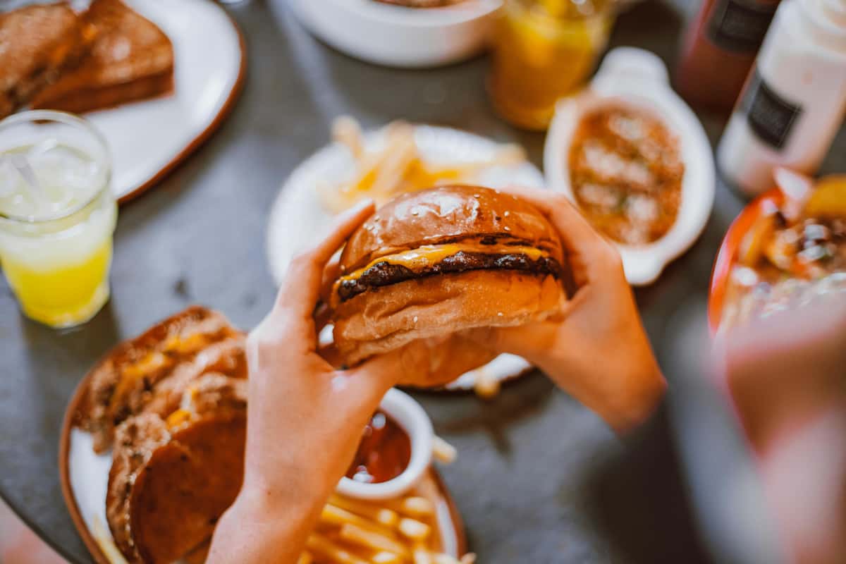 Burger and other dishes on the table
