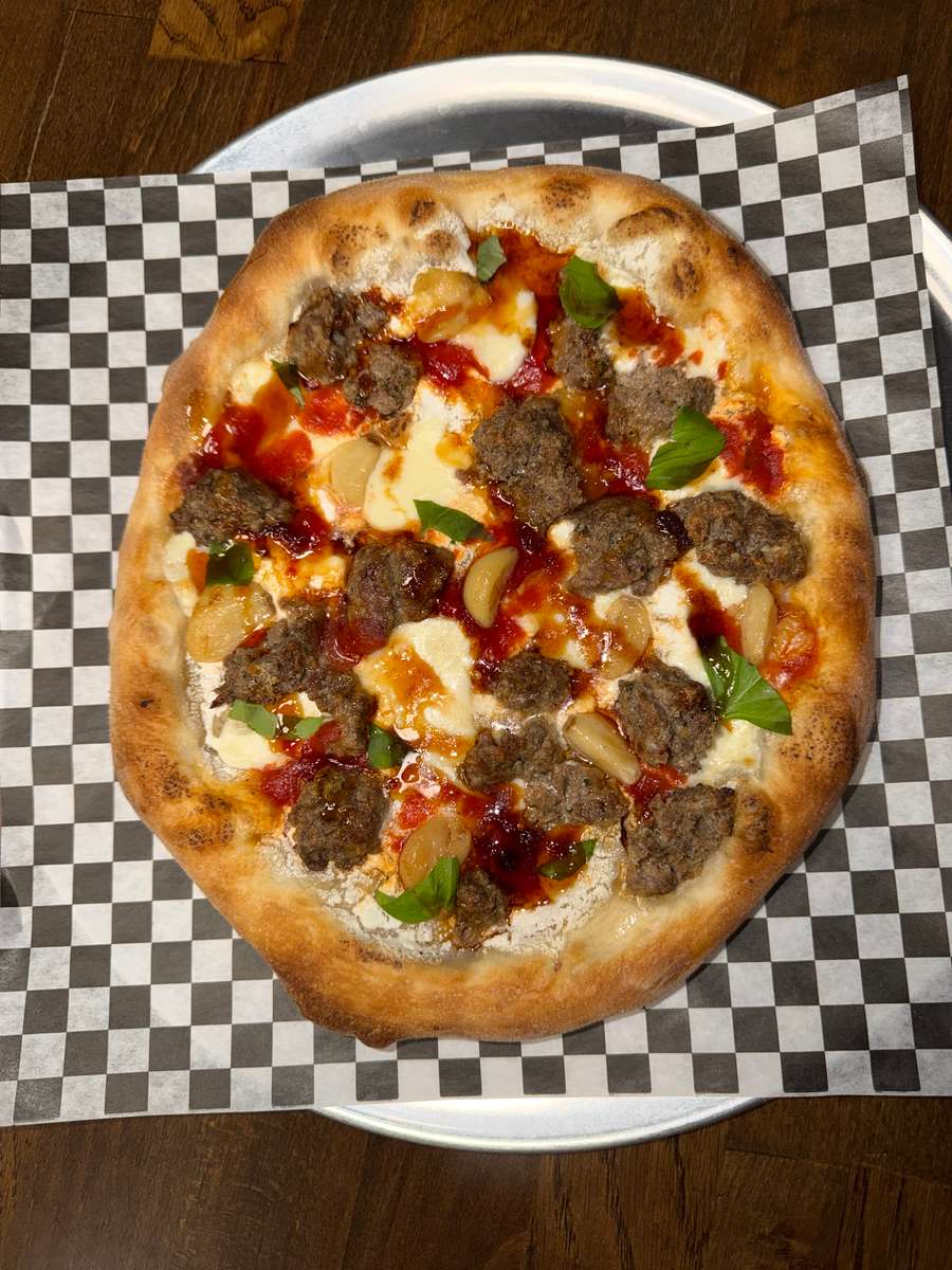Red sauce, Mozzarella, Meat balls, Garlic confit Garlic ricotta boll ups, and Mikes hot honey.