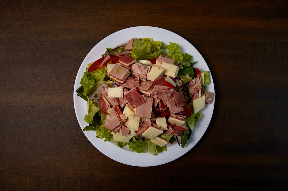 Salami, mortadella, capicollo, roma tomatoes, red onions & sliced mozzarella cheese