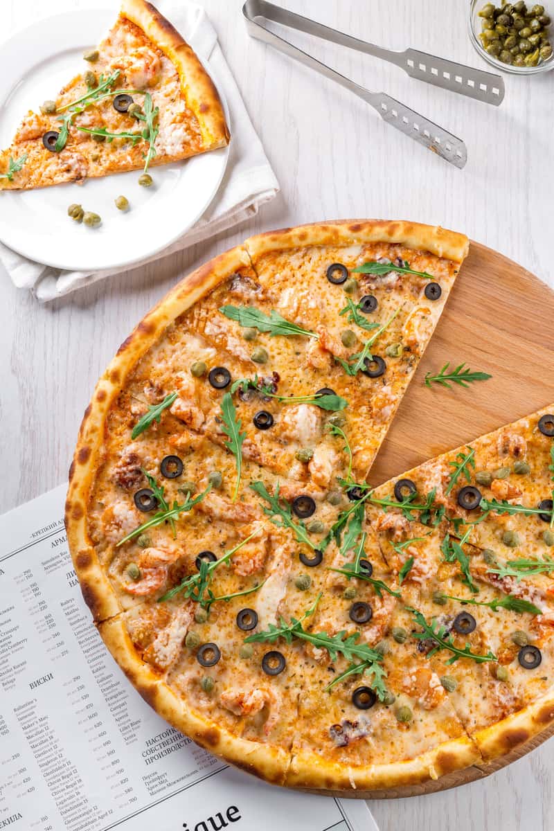pizza with olives and greens