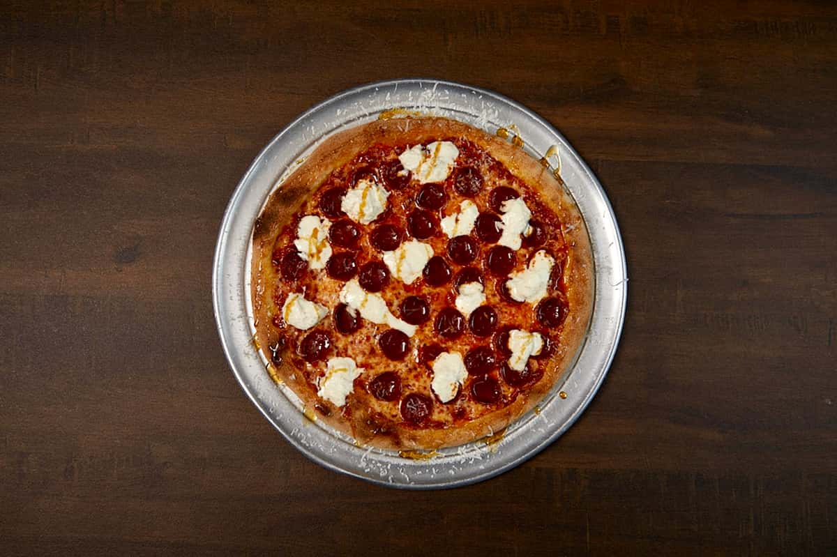 Our house made tomato sauce, Grande mozzarella cheese, Ezzo cupping pepperoni, Mike's Hot Honey, Pecorino Romano cheese and imported Italian stracciatella.