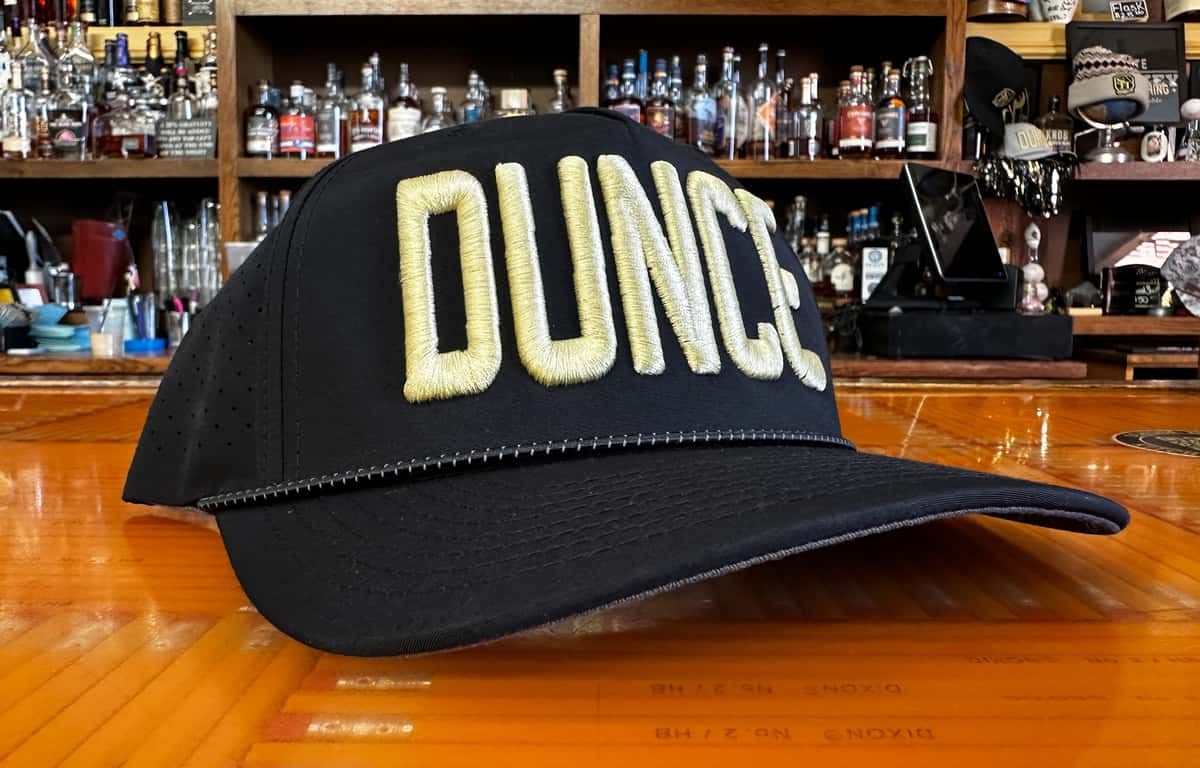 Photo of black hat with the word "Dunce" embroidered across the front