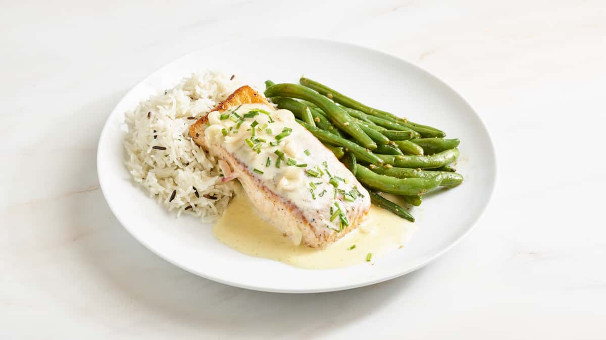 8 oz farm raised salmon filet cooked to perfection in a white wine onion lemon cream sauce, served with a basmati and wild rice medley and sautéed garlic green beans