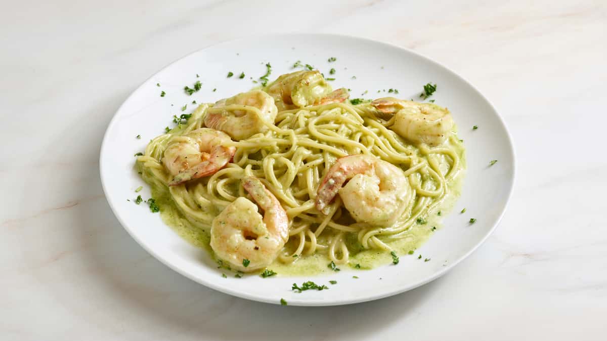 Six jumbo tiger shrimp sauteed in garlic and olive oil, folded into a creamy pesto sauce then tossed with al dente pasta