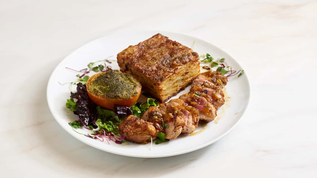 Duck breast with a cognac and honey sauce - served with potatoes dauphinoise and tomato provençal