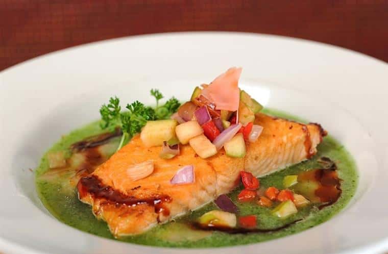 SALMON FLORENTINE: pan seared salmon, roasted red pepper spinach cream sauce, cauliflower fried rice