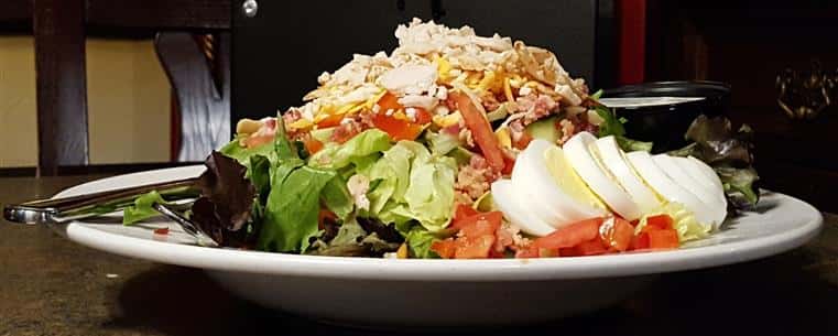 Fox Cobb Salad: Smoked turkey, crisp bacon, egg, tomato, cucumber, red pepper, blue cheese crumbles