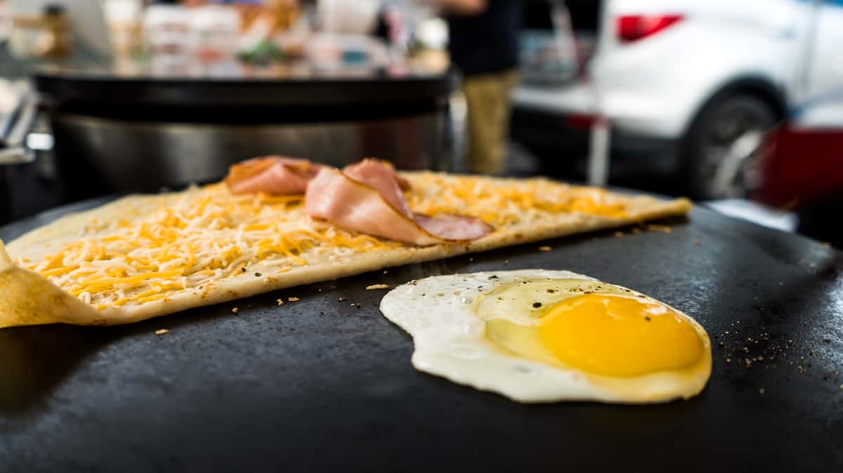 ham and egg crepe on grill