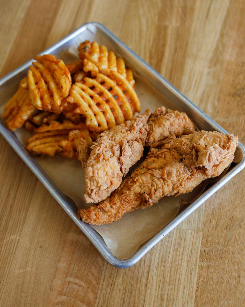 Two hand breaded tenders served with fries