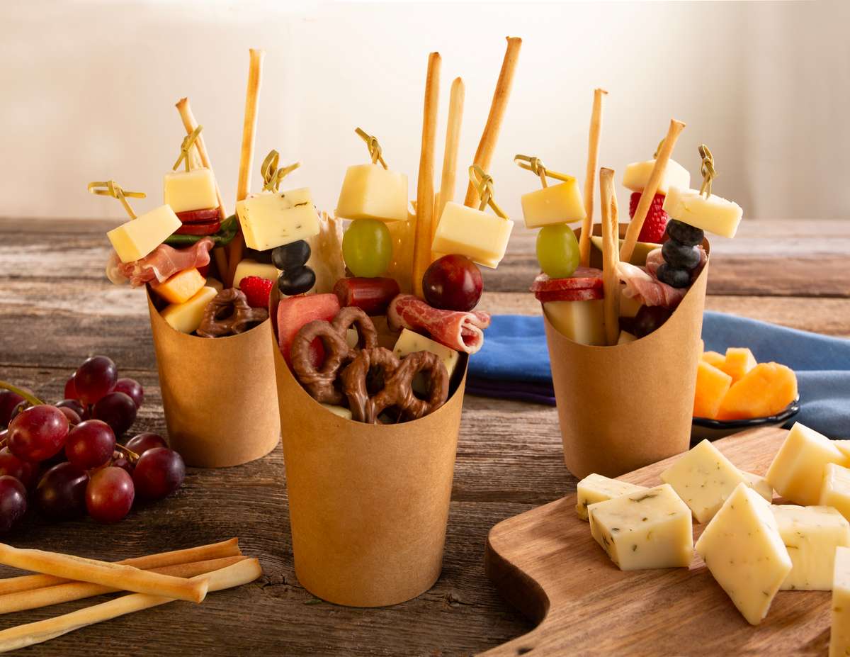 Charcuterie Cups with gouda, meat and fruit on skewers