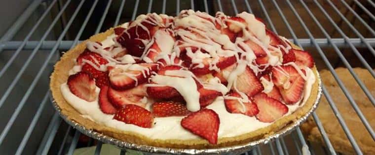 pie topped with strawberries