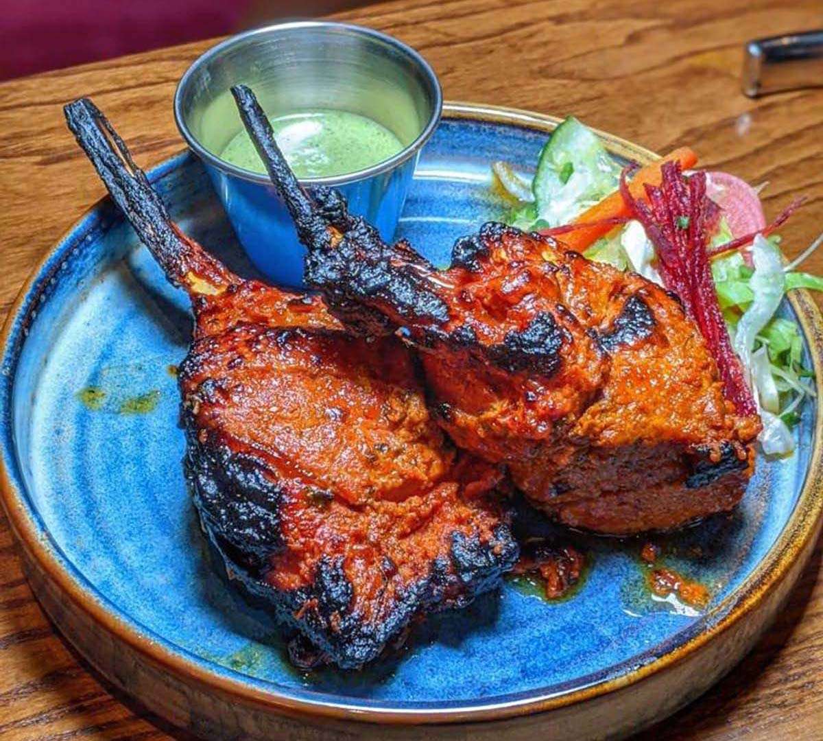 New Zealand lamb chops, double marinated in tandoori mix and grilled in clay oven