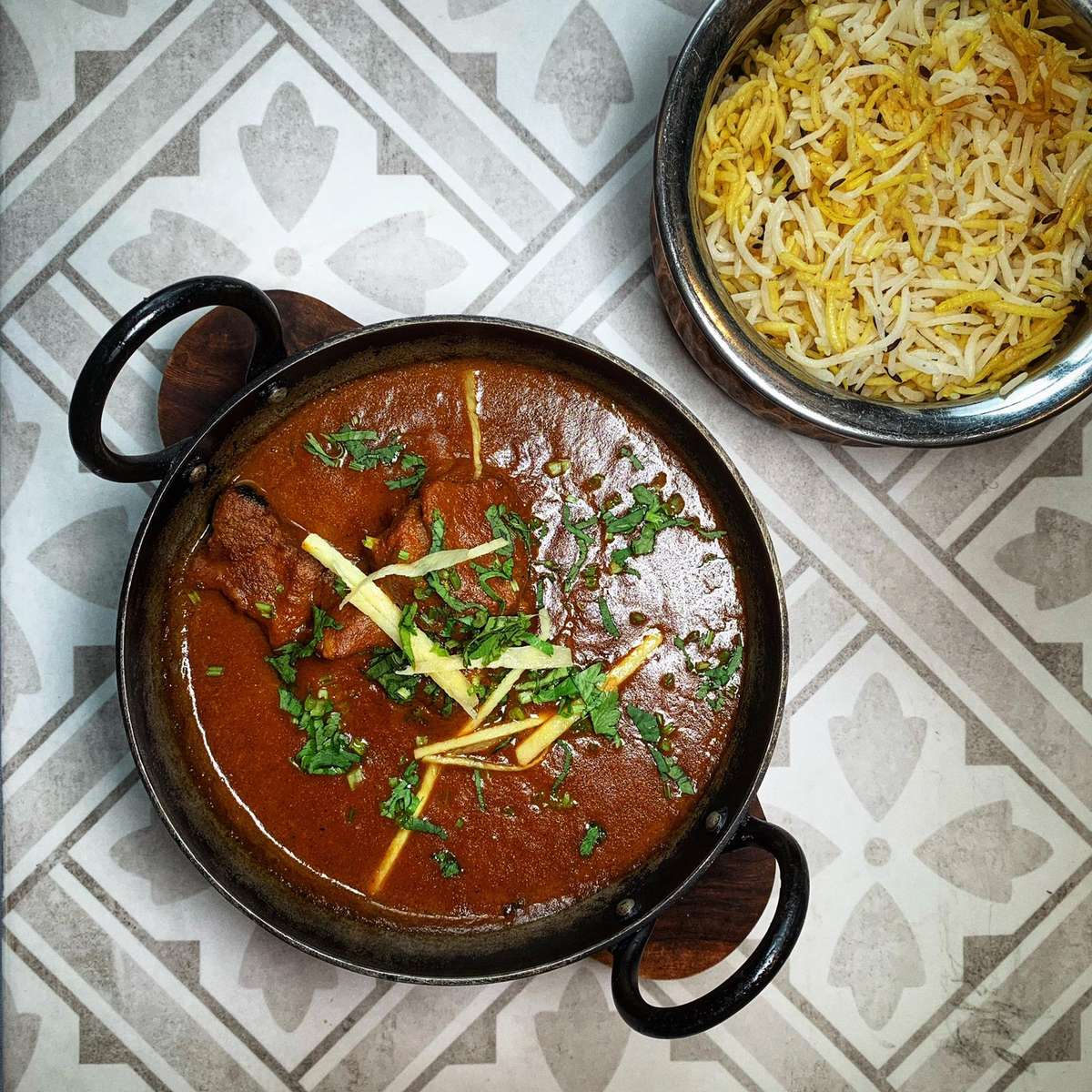 Authentic Indian food delivery St Albans from Infuse Lounge featuring butter chicken, naan, and rice served fresh.