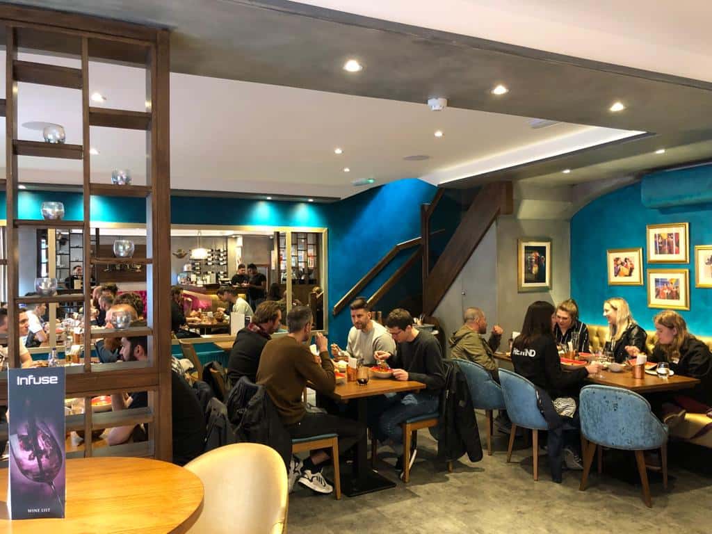 A happy family enjoying a meal at Infuse, the top family-friendly Indian restaurant in St Albans.