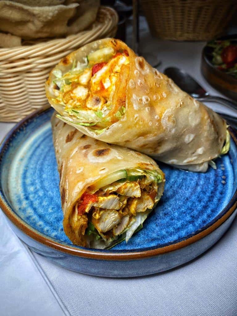 Chicken jalfrezi wrapped in paratha with salad and chutney