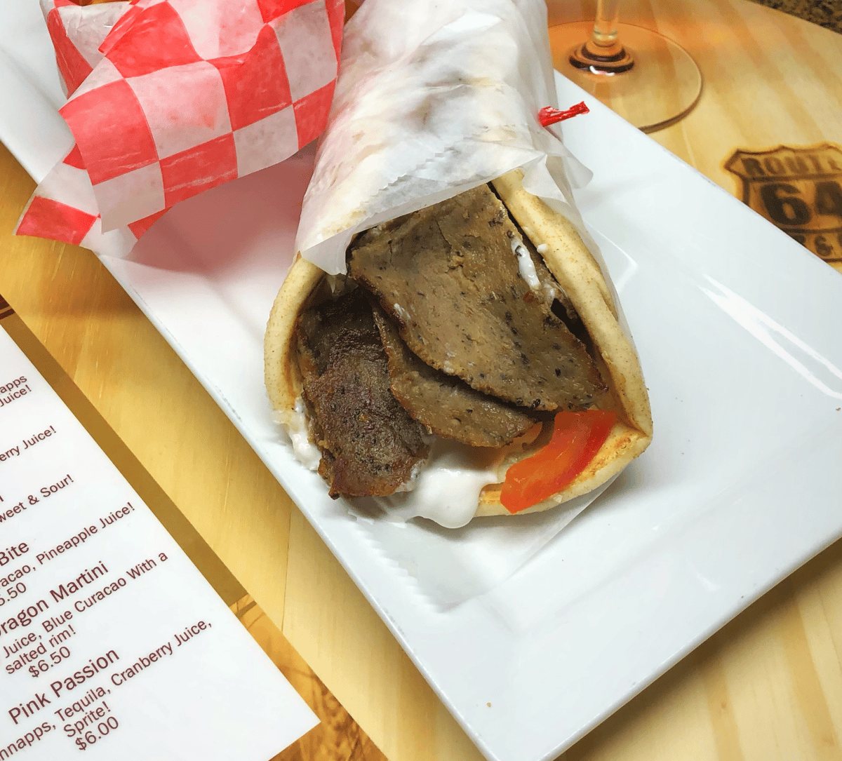 Gyro on plate with menu on side 