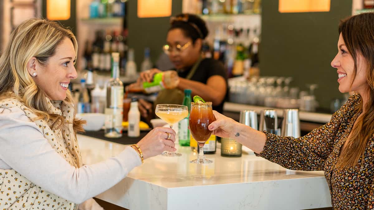 Guests toasting with cocktails