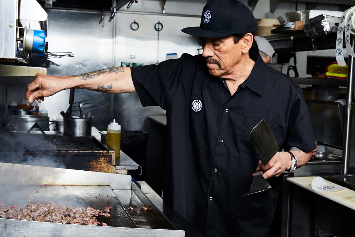 Danny Trejo preparing a food order