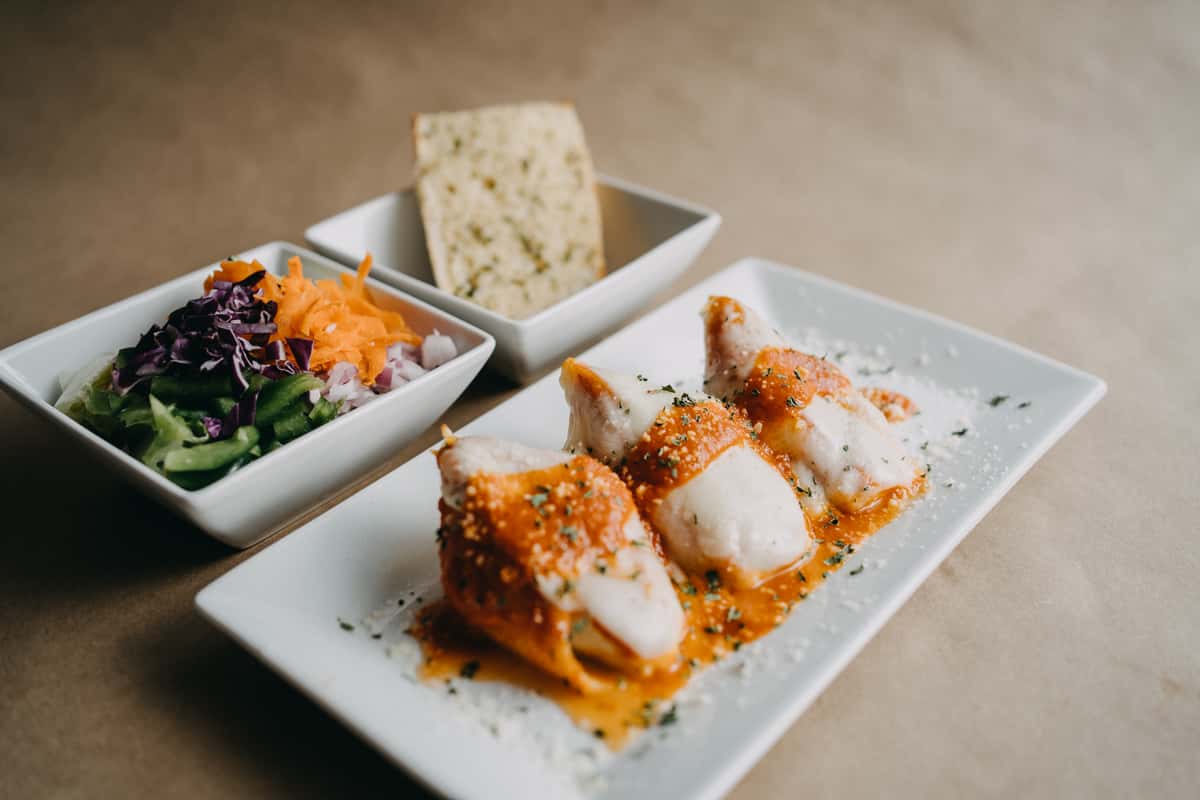 Stuffed shells with side salad and garlic bread