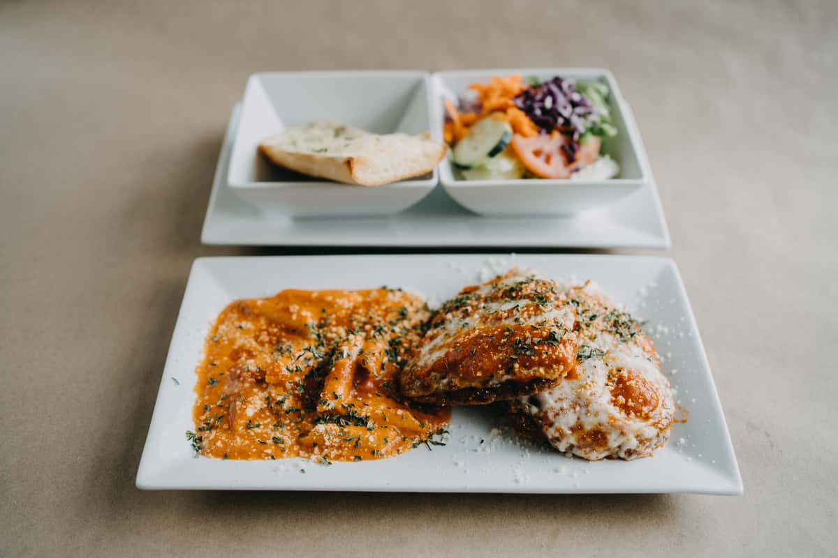 Breaded eggplant topped with our home-made tomato sauce and mozzarella cheese and oven baked, served with choice of pasta. Served with garlic bread.