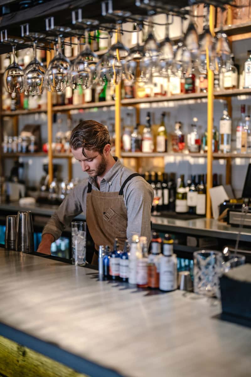 Barista serving on a bar