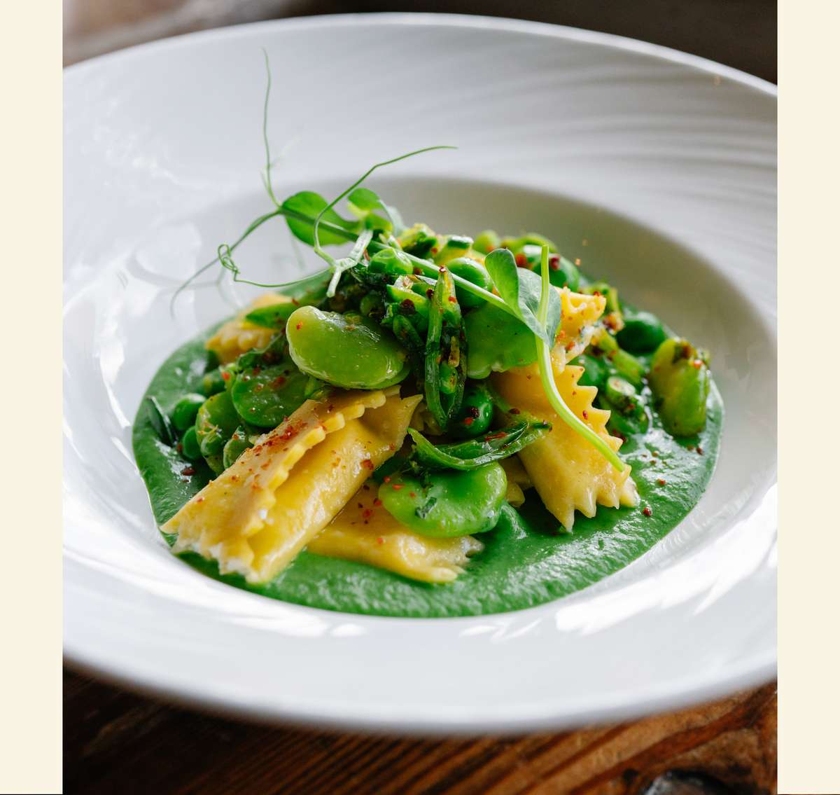 white plate with green pasta
