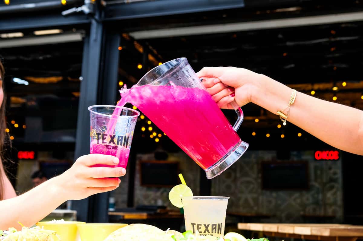Pink drink being served