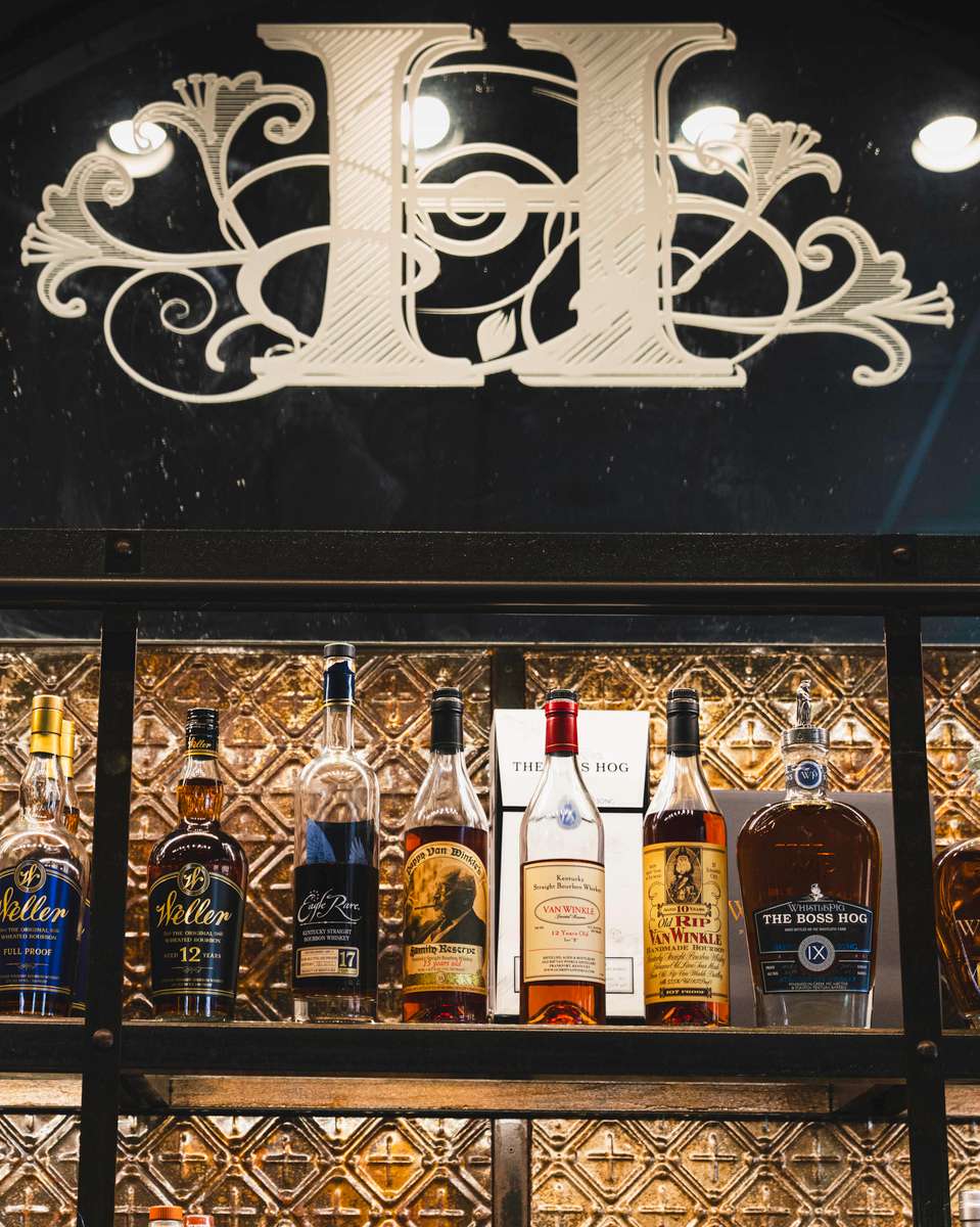 shelf with bottles of spirits