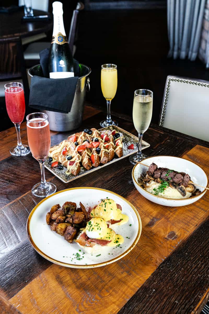 spread of menu items and beverages from The Honeysuckle