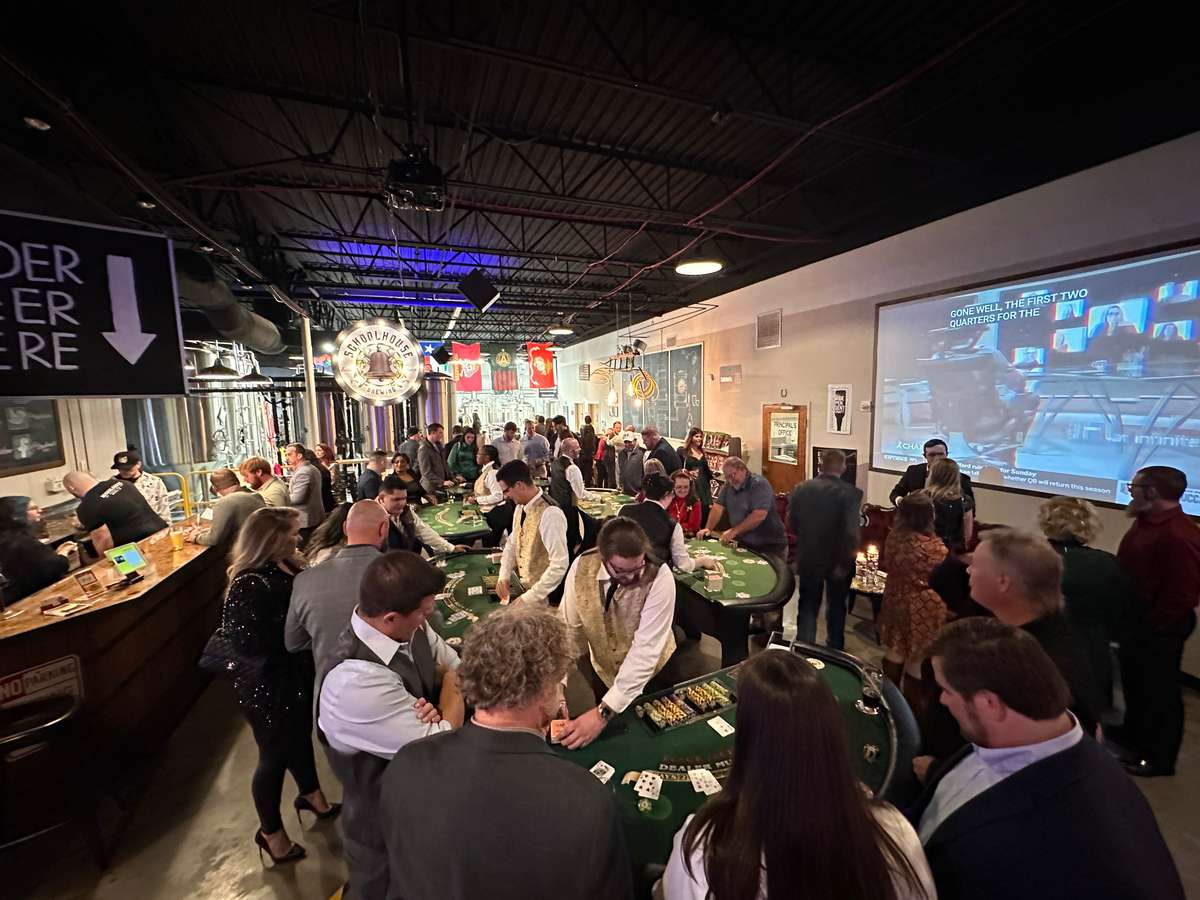 Guests enjoying casino night at Schoolhouse Brewing
