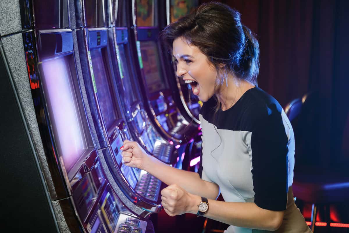 Woman playing at a casino slot machine