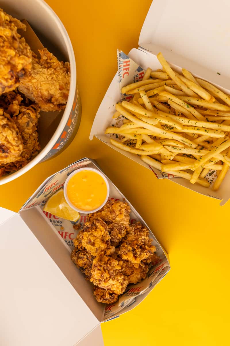 overhead shot of fried chicken and fries